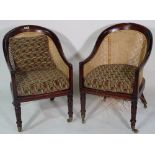 A pair of William IV style tub back library bergeres on lappet supports, 53cm wide 86cm high (2).