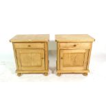 A pair of 20th century pine single drawer bedside cupboards, on bun feet, 50cm x 55cm high, (2).