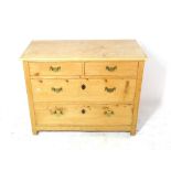 A 20th century pine chest of two short and two long drawers, 101cm wide x 79cm high.