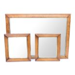 A Victorian bird's eye maple frame with later mirror plate, 60 x 82cm, and a similar smaller pair,