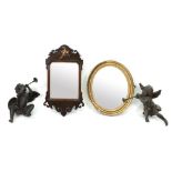 A small reproduction Chippendale style walnut and gilt fret carved frame mirror, 51cm high,