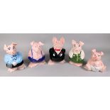 A graduated set of five Wade NatWest pig money boxes.