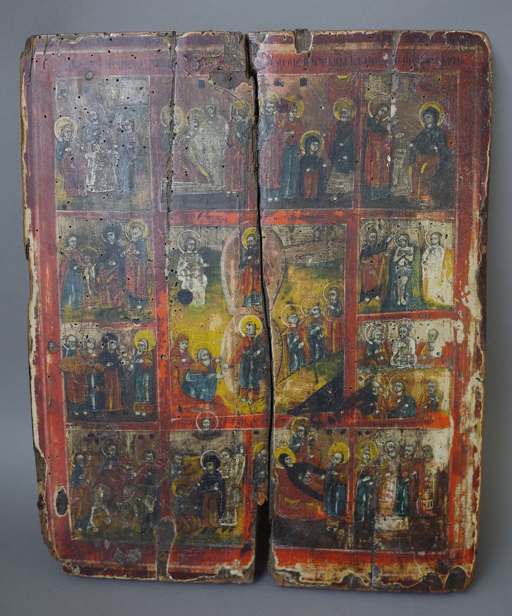 A Greek Icon, possibly 19th century, polychrome painted with Jesus and attendants, 39cm x 32cm. (a.