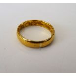 A 22ct gold plain wedding ring, Birmingham 1922, ring size R, weight 5.6 gms.