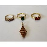 Three 9ct gold and gem set rings in a variety of designs and a 9ct gold and gem set marquise shaped
