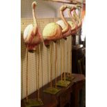 A group of four 20th century painted metal figures of flamingos, 119cm high, (4).