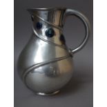 A Liberty Tudric pewter jug, after a design by Archibald Knox,