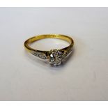 A gold and platinum, diamond set ring,