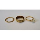 A 9ct gold plain wedding ring, a gold wide band wedding ring and a gold ring,