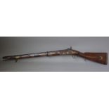 A late 18th century flintlock pistol by Archer, with circular steel barrel, 11cm,