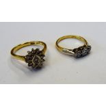 A gold and platinum, diamond set three stone ring,