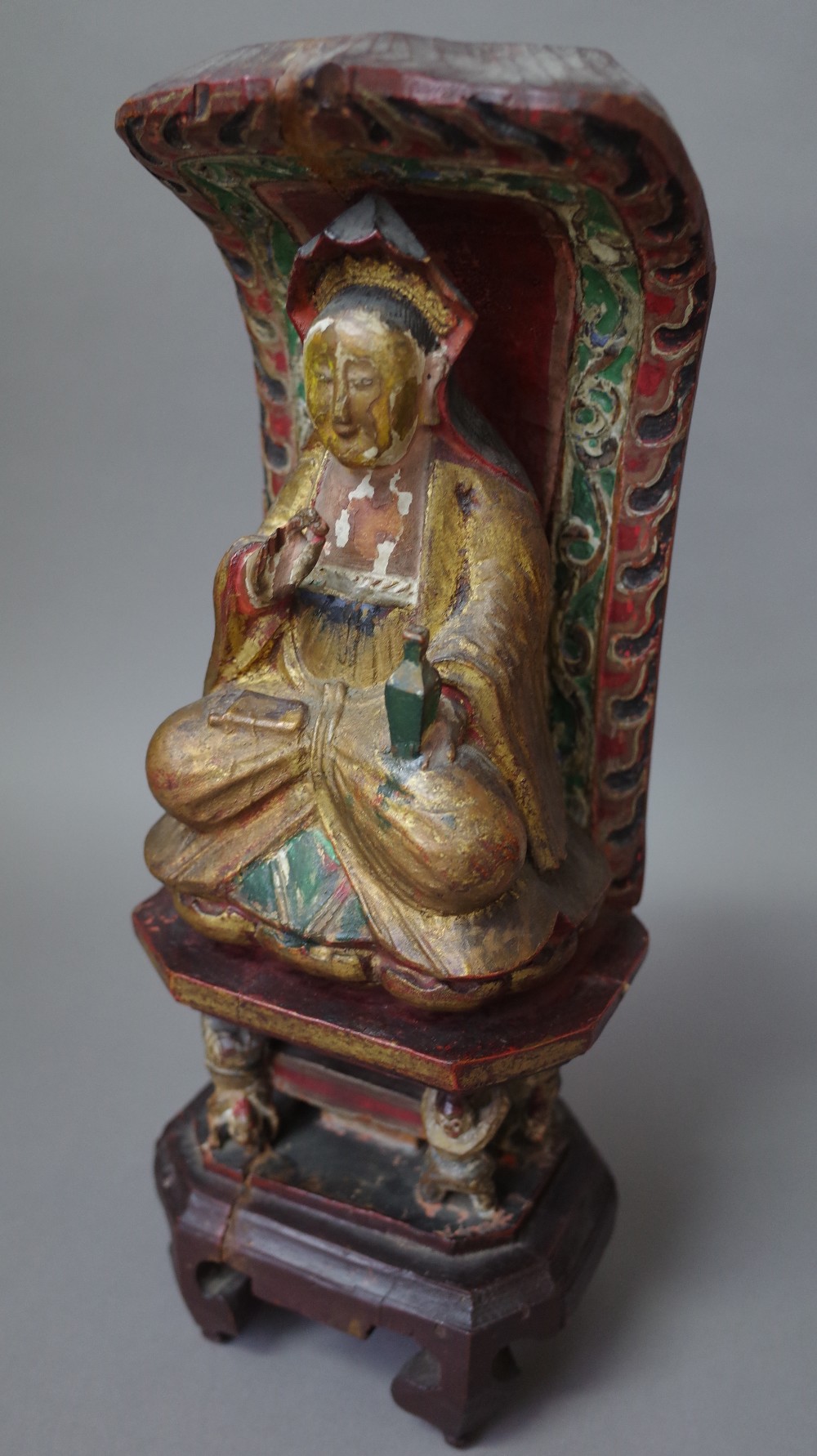 A Chinese polychrome carved wooden Buddha figure, late 19th century,