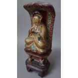 A Chinese polychrome carved wooden Buddha figure, late 19th century,