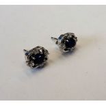 A pair of sapphire and diamond, oval cluster ear studs,