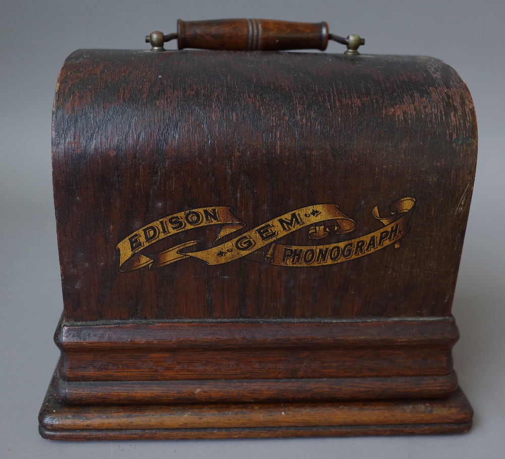 An Edison 'Gem' phonograph in an oak case.