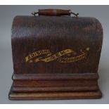 An Edison 'Gem' phonograph in an oak case.