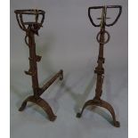 A pair of late 19th century wrought iron andirons, 84cm high (2).