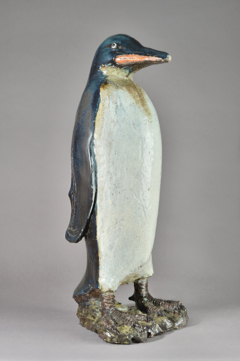 In the manner of Tracey Elizabeth Wright, a saltglaze stoneware penguin, unsigned,