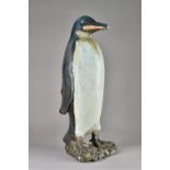 In the manner of Tracey Elizabeth Wright, a saltglaze stoneware penguin, unsigned,