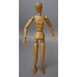 A mid-20th century artist's beech lay figure with articulated joints, 41cm.