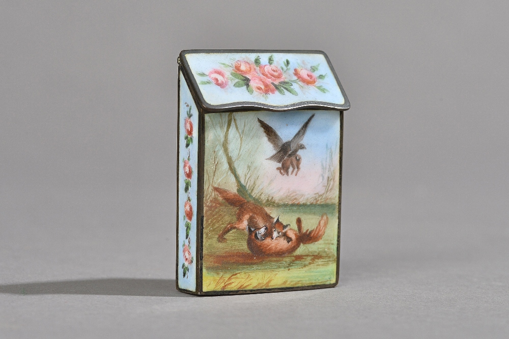 A Victorian enamel vesta case decorated with playful foxes,