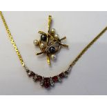 A 9ct gold, ruby and diamond set necklace, the front with a fanned motif,