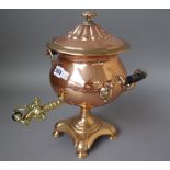 A Victorian copper and brass mounted samovar of circular form,