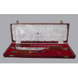 Harrods London; a three piece stag horn handled carving set, steel blades,