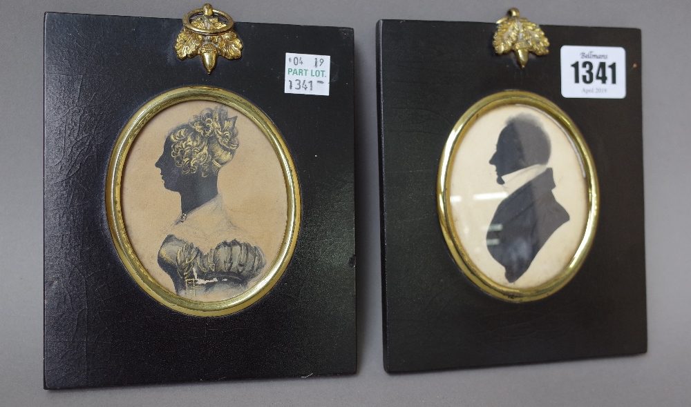 Two silhouettes dated 1822, male and female busts with indistinct pencil detail to rear, 14.