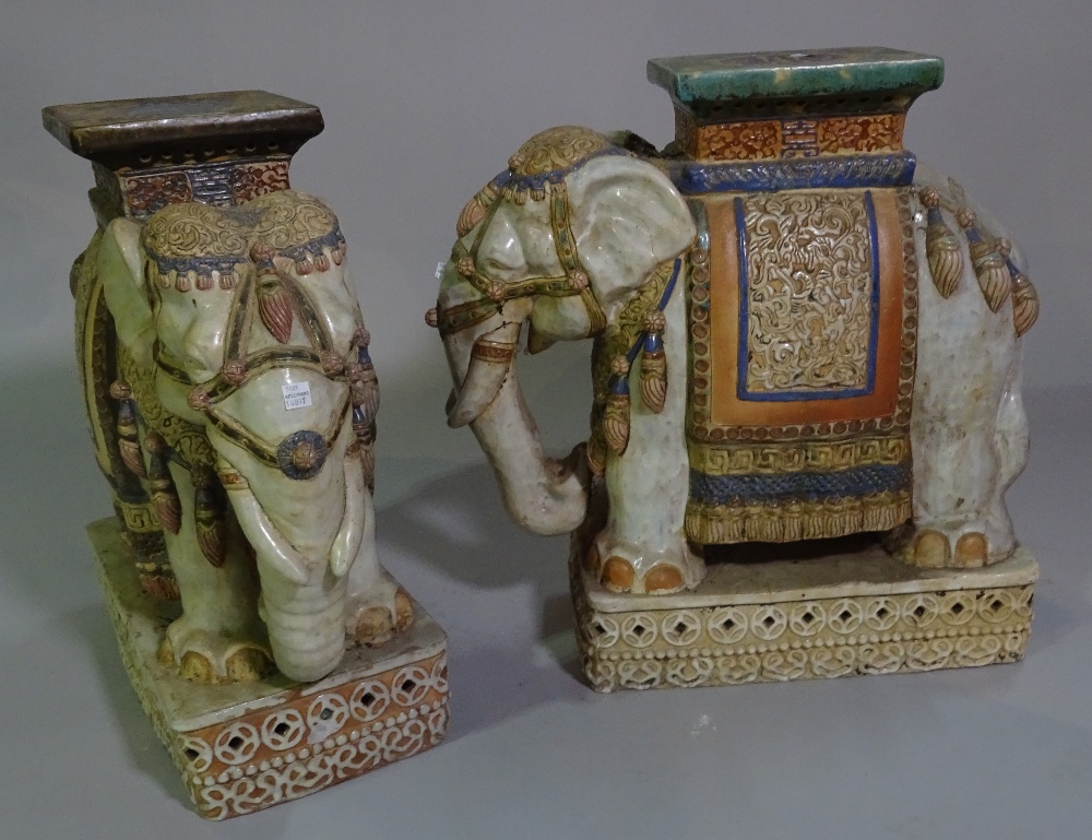 A pair of 20th century ceramic garden seats formed as elephants, 55cm high (2).