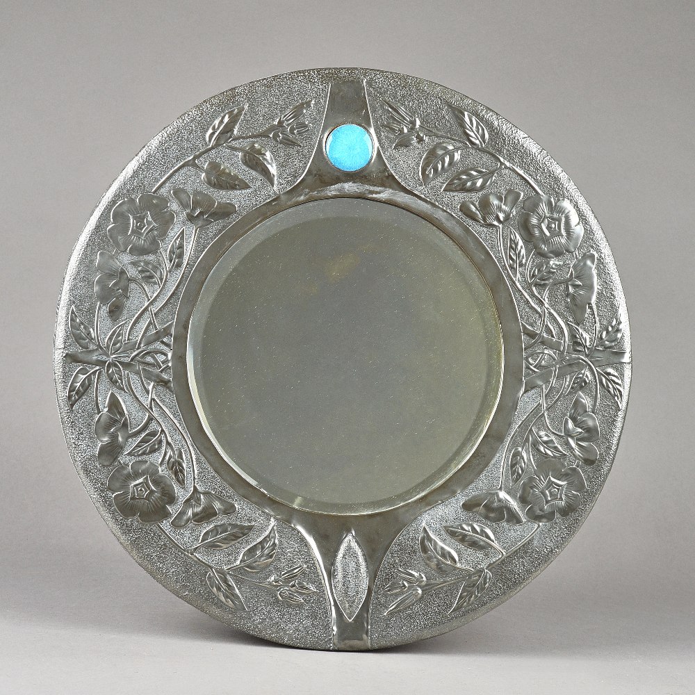 A Liberty style Arts and Crafts pewter wall mirror, circa.