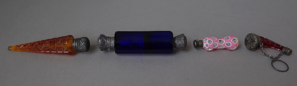 A silver mounted Bristol blue glass double ended scent bottle and three smaller coloured glass