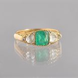 A gold, emerald and diamond ring, mounted with the square cut emerald to the centre,