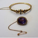 A gold, amethyst and seed pearl set oval brooch,