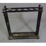 An early 20th century cast iron six division stick stand, 60cm wide x 64cm high.