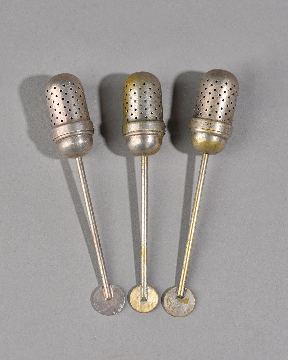 Bauhaus Design, Christian Dell; three silver plated tea infusers, circa 1924-1929, 13cm, (3).