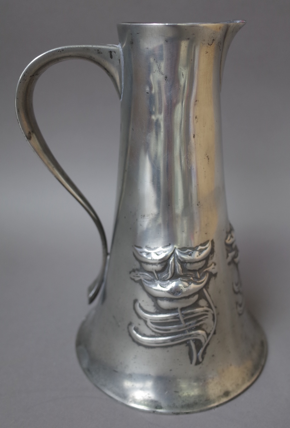 A Liberty Tudric pewter water jug, after a design by Archibald Knox,