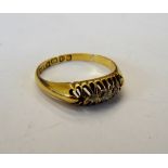 An 18ct gold ring, mounted with three small cushion shaped diamonds (two further diamonds lacking),