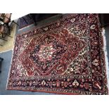 A Bakhtiari carpet, white ground with polychrome medallion and floral decoration,