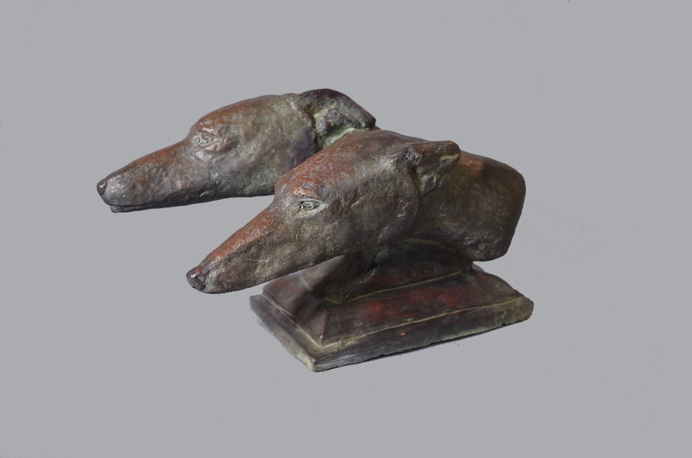 A modern bronzed pottery animalier bust of two greyhound heads, stepped plinth base,