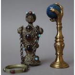 A gilt metal figural scent bottle, early 20th century,