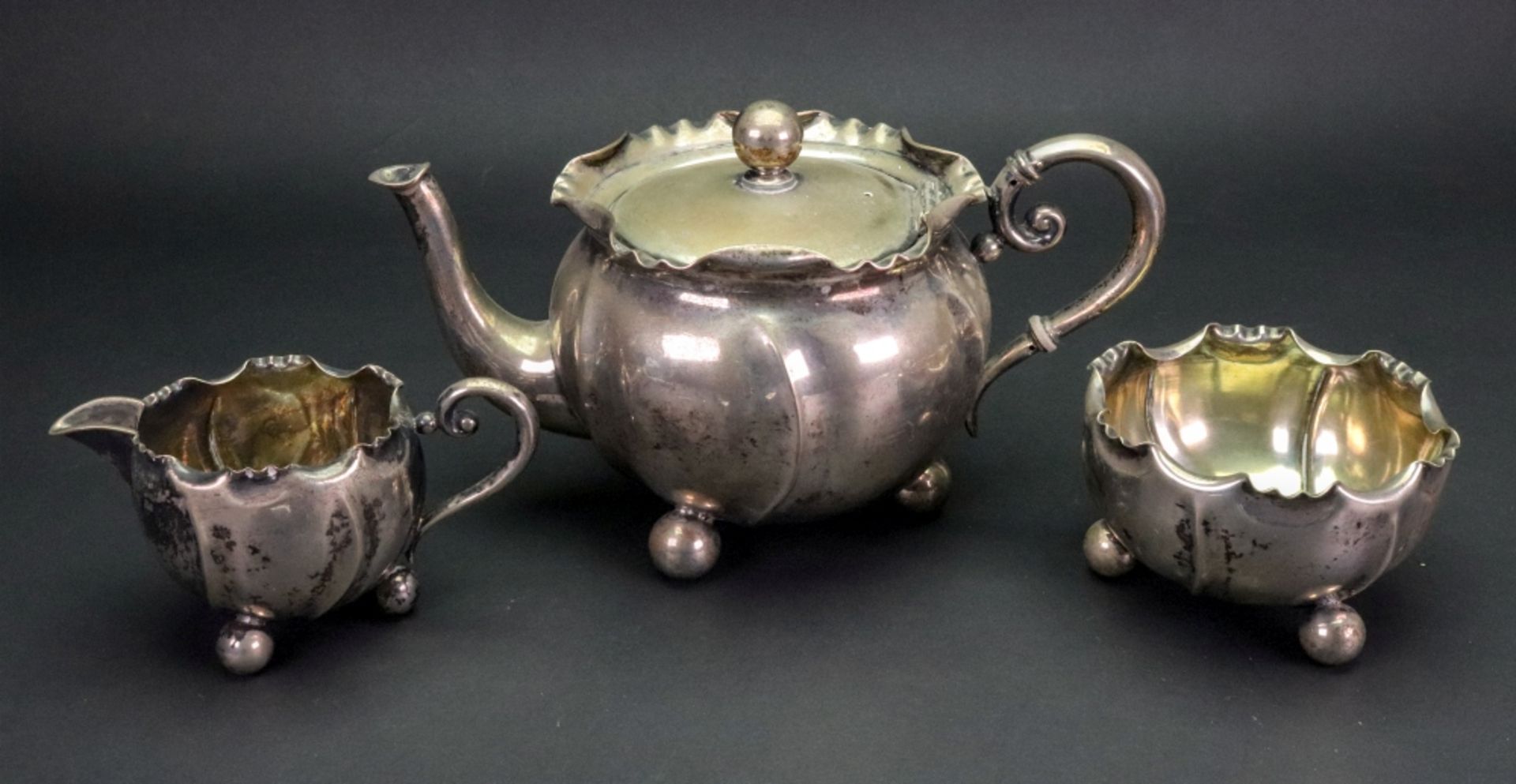 A Bachelor late 19th century three piece silver tea service, detailed 800 WTB, circular,
