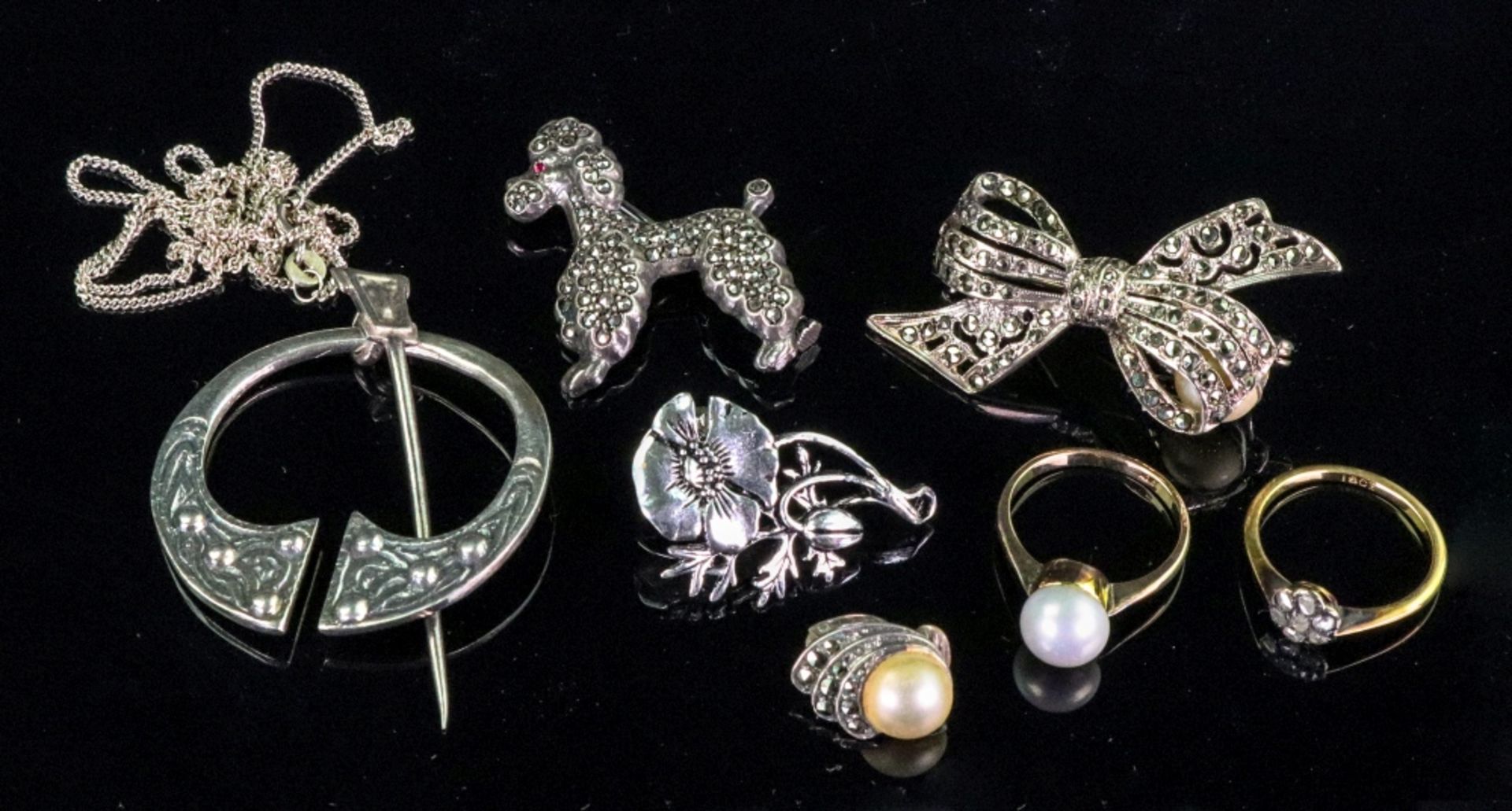 A collection of costume jewellery, comprising; four brooches, a silver chain, a cultured pearl ring,