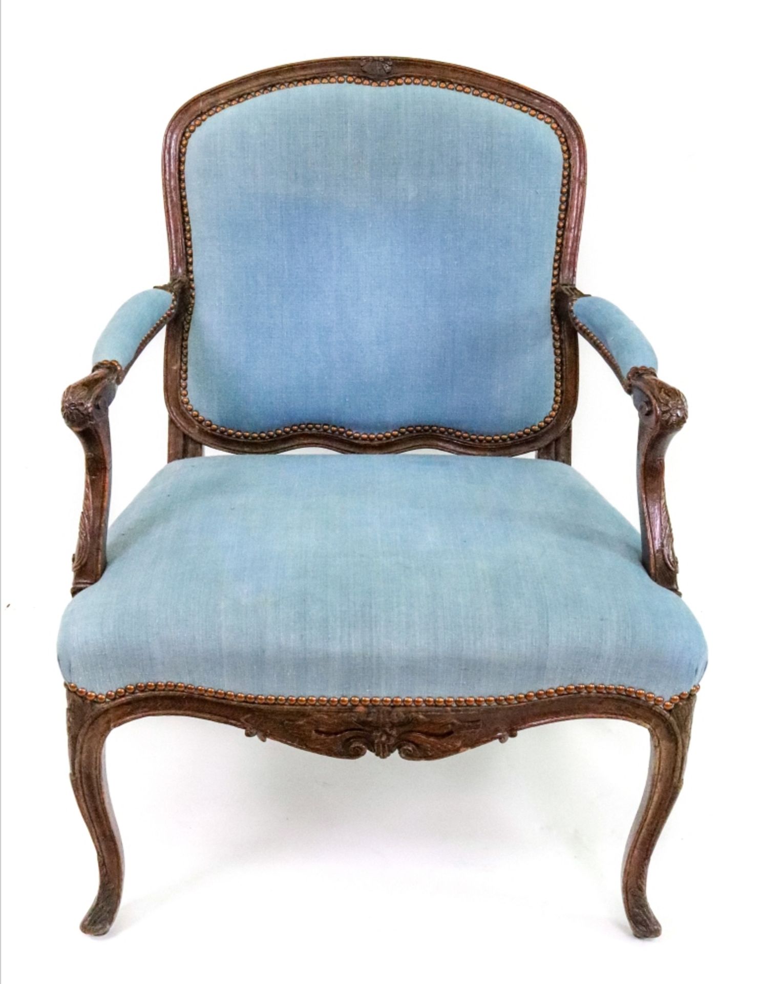 A Louis XV style oak frame fauteuil, first half 19th century, moulded and foliate carved,