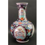 A Chinese famille rose bottle vase, 20th century, probably made for the Tibetan market,