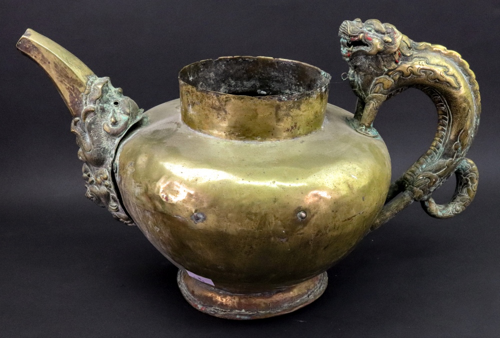 A large Asian brass pouring vessel, possibly Tibetan, late 19th century,