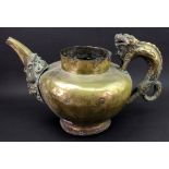 A large Asian brass pouring vessel, possibly Tibetan, late 19th century,