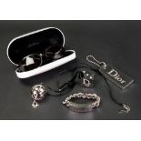 Dior; a bracelet together with a Dior Swarovski Dice lipstick container,