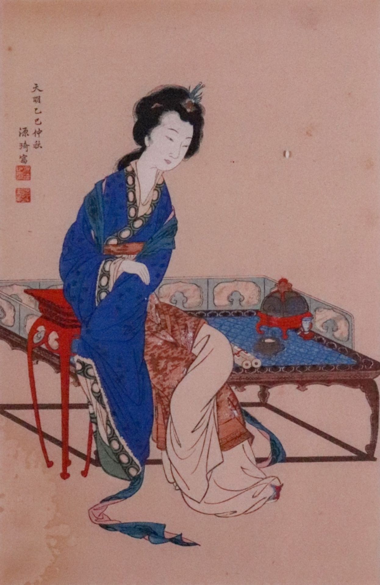 A Japanese woodblock print of a seated lady, signed, 29 x 19cm.