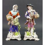 A pair of continental porcelain figures, one modelled as a young man in a floral coat,